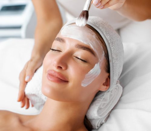 a woman sitting on a bed